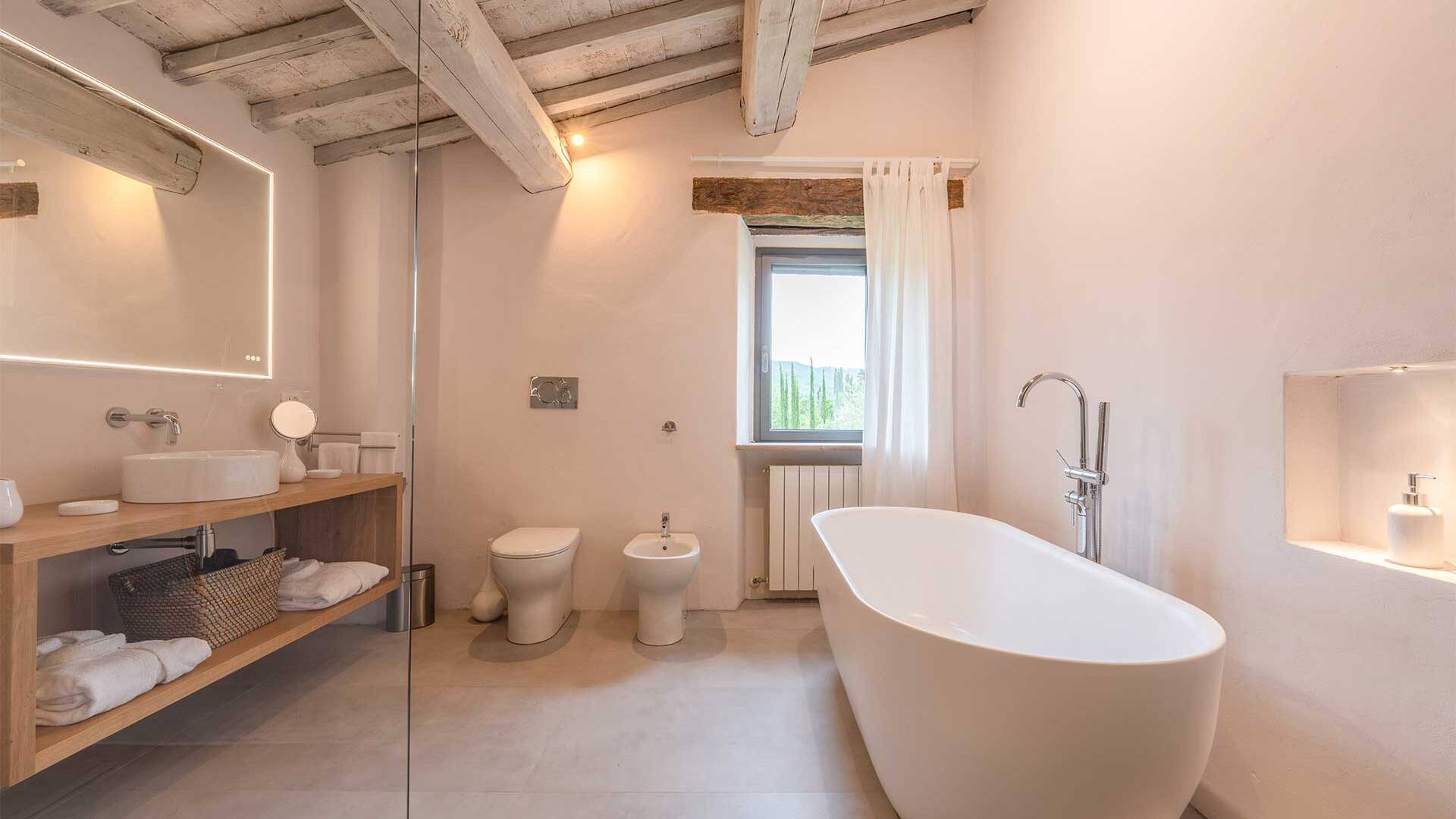 en suite bathroom with walk-in shower and bath tub